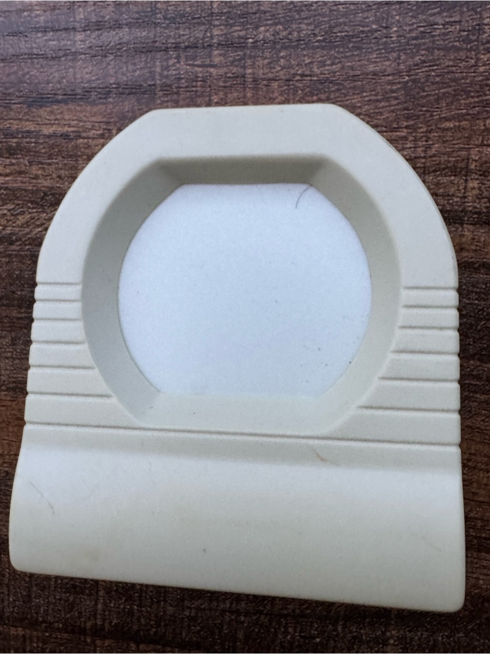 Plug in flat panel electroluminescent night light emitting a soft green glow.